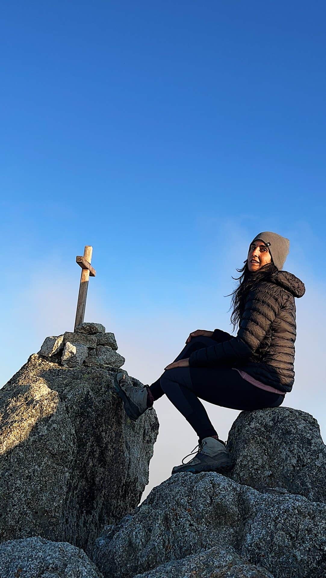 Hiker on top of monte rotondo the GR 20 trail in Corsica