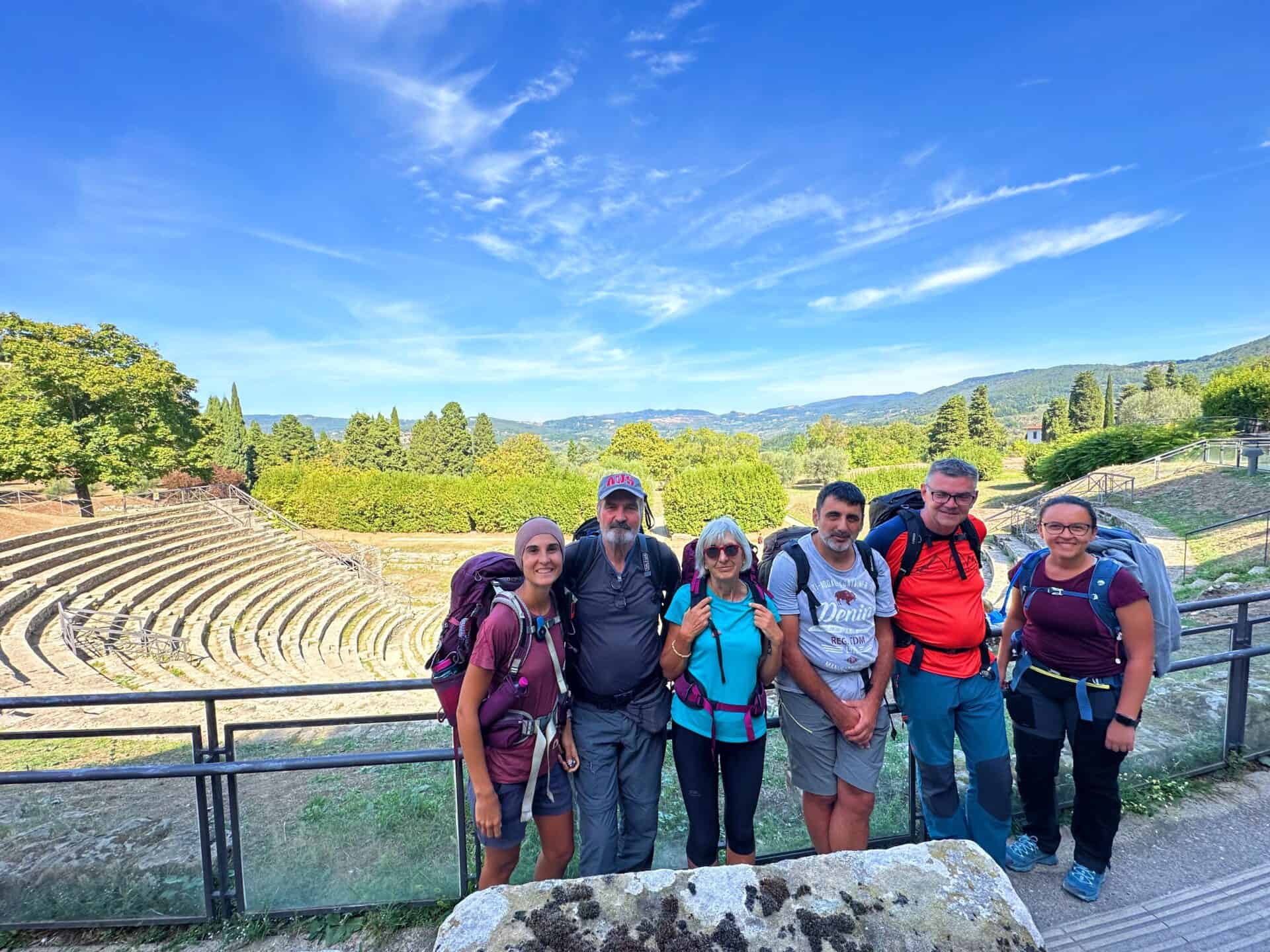 hikers on la via degli dei at the fiesole amphitheatre